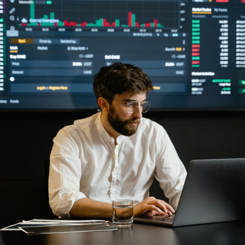 Man in White Dress Shirt Using Laptop